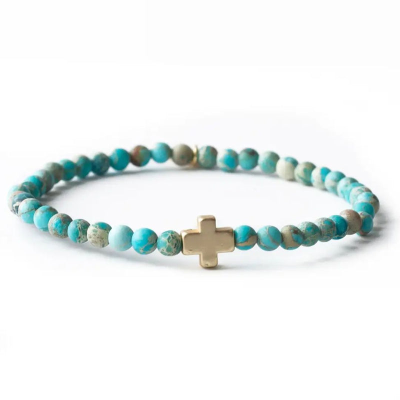 Turquoise jasper beaded bracelet with gold cross charm