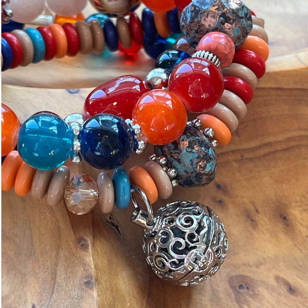 Close-up of silver pendant with lava rock on bracelets for essential oils