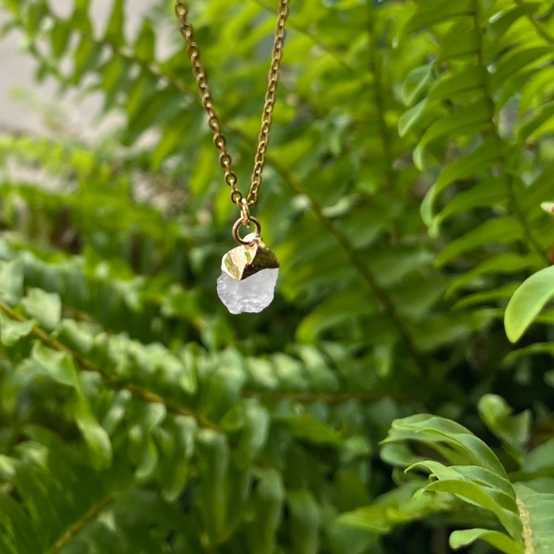Light pink rose quartz pendant on gold chain