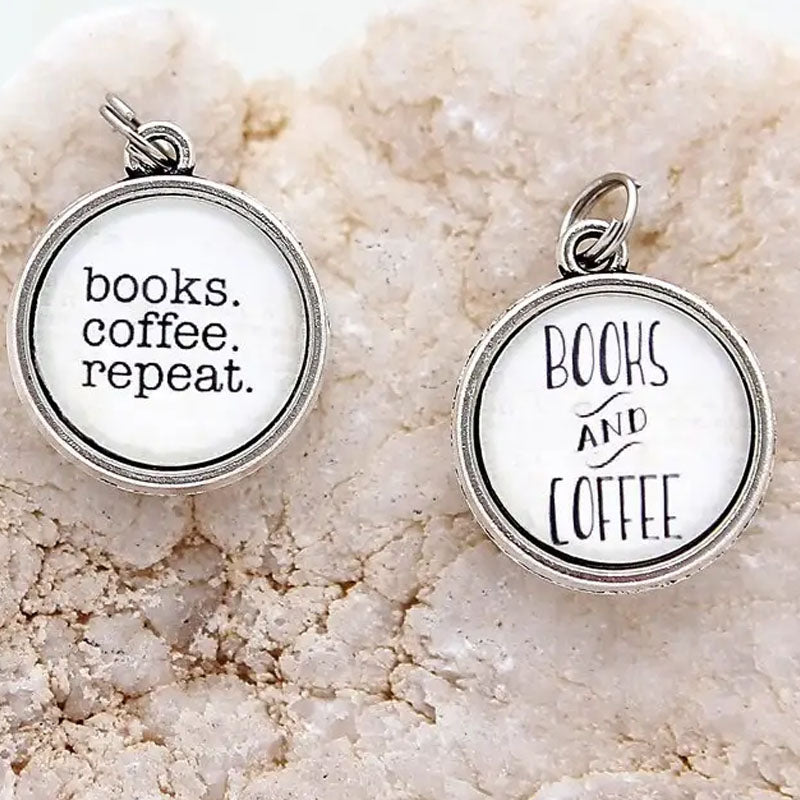 Double sided necklace pendant. One side reads "books. coffee. repeat." and the other side says "Books and Coffee"