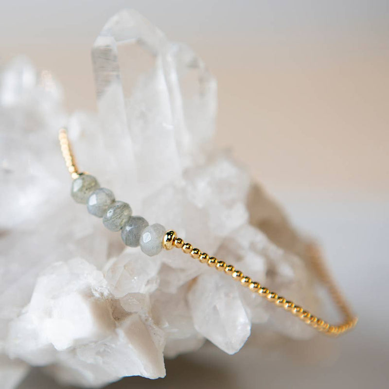 Lenny & Eva Dream Big bracelet. A bracelet with tiny gold beads for the band and a section of earthy green colored labradorite beads.