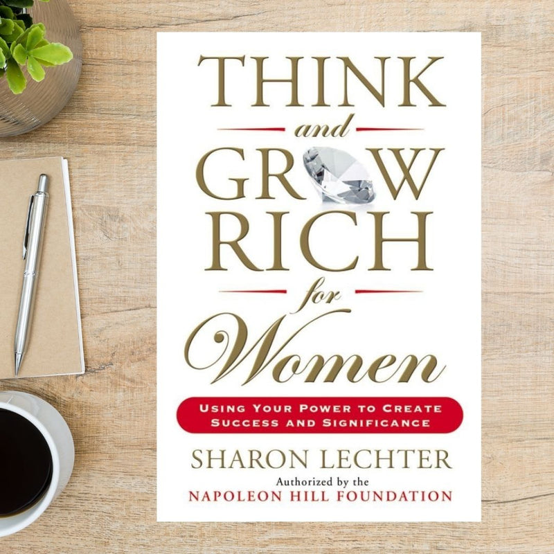 White paperback book, "Think and Grow Rich for Women" by Sharon Lechter.