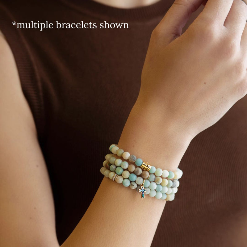 Model wearing a stack of Amazonite bracelets