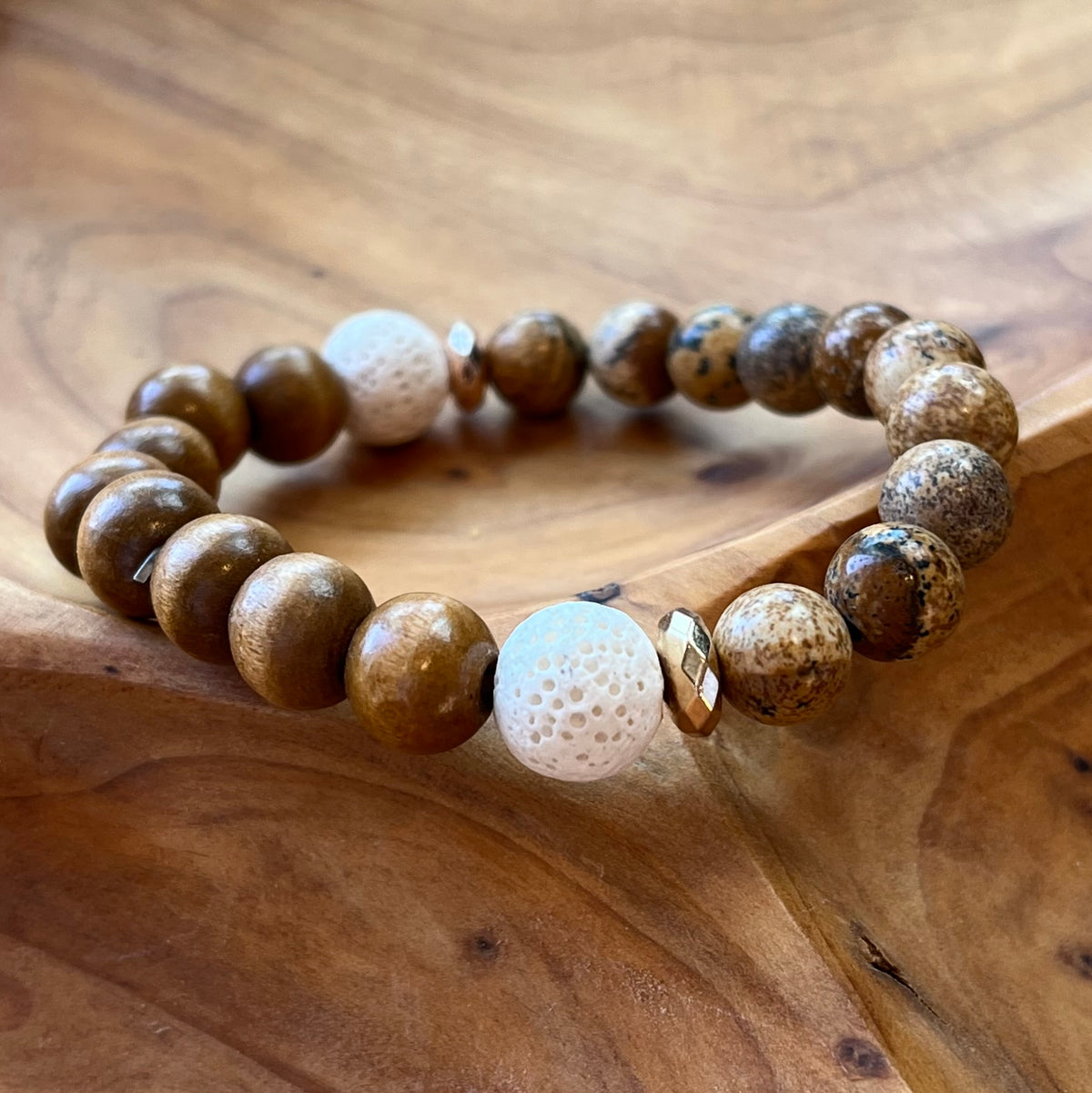 Earthy brown toned beaded bracelet with 2 white lava rocks for essential oils