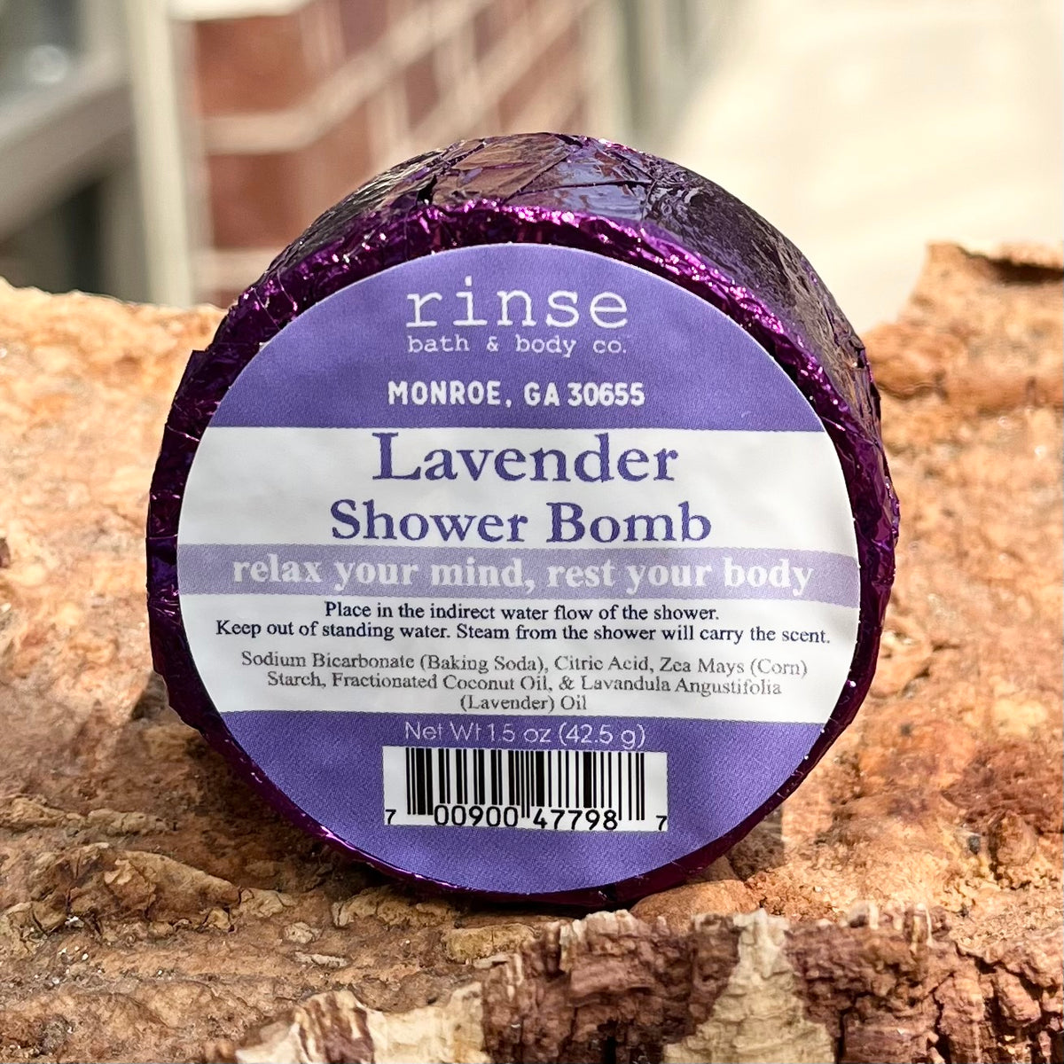 Lavender shower bomb in shiny purple wrapper