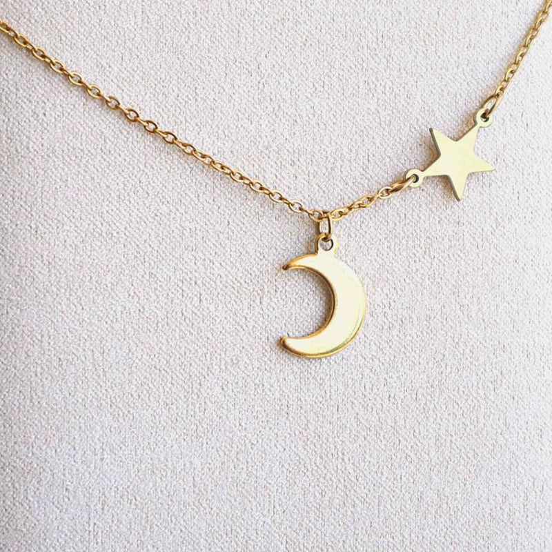 Gold star & crescent moon pendants on gold chain