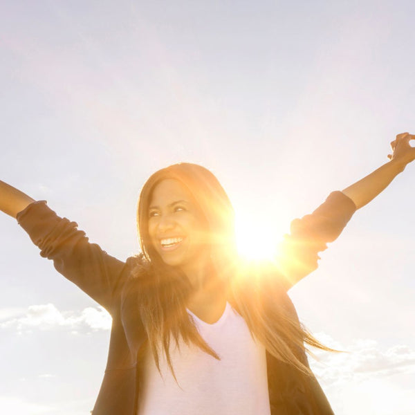 Woman standing in sunshine