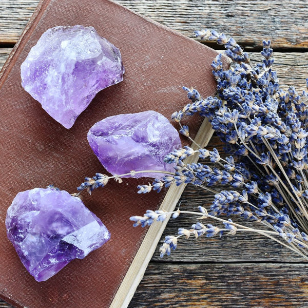 Amethyst crystals on book