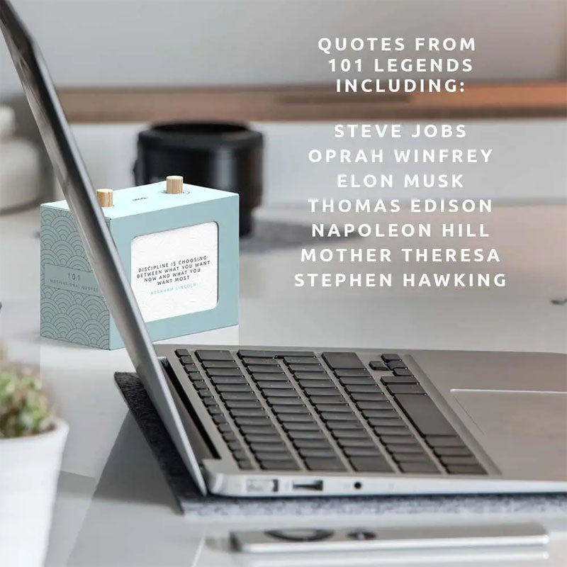 101 Motivational Quotes Box sitting on desk by laptop
