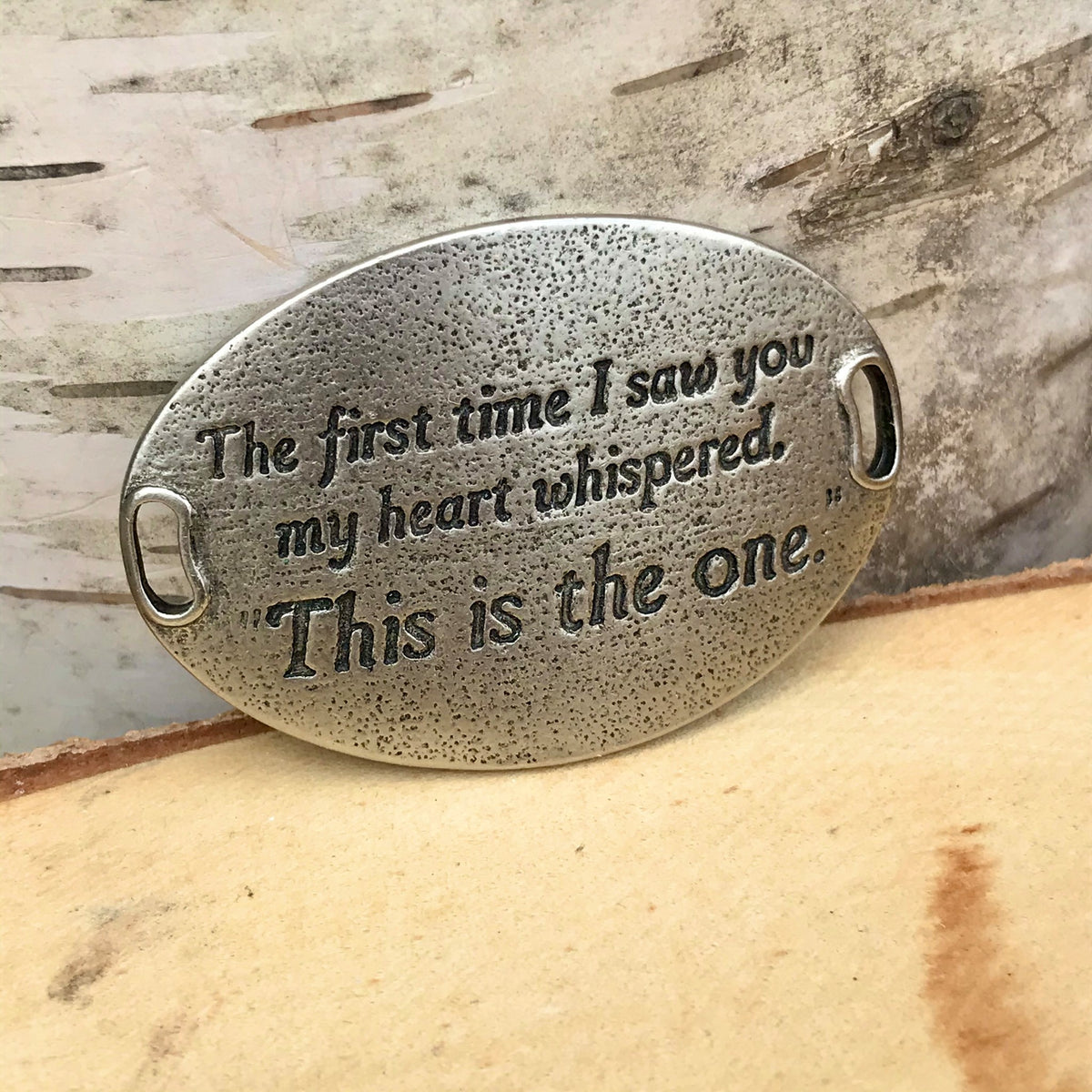 Oval shaped, antique silver finish Lenny & Eva bracelet sentiment that reads, "The first time I saw you my heart whispered, 'This is the one.'"