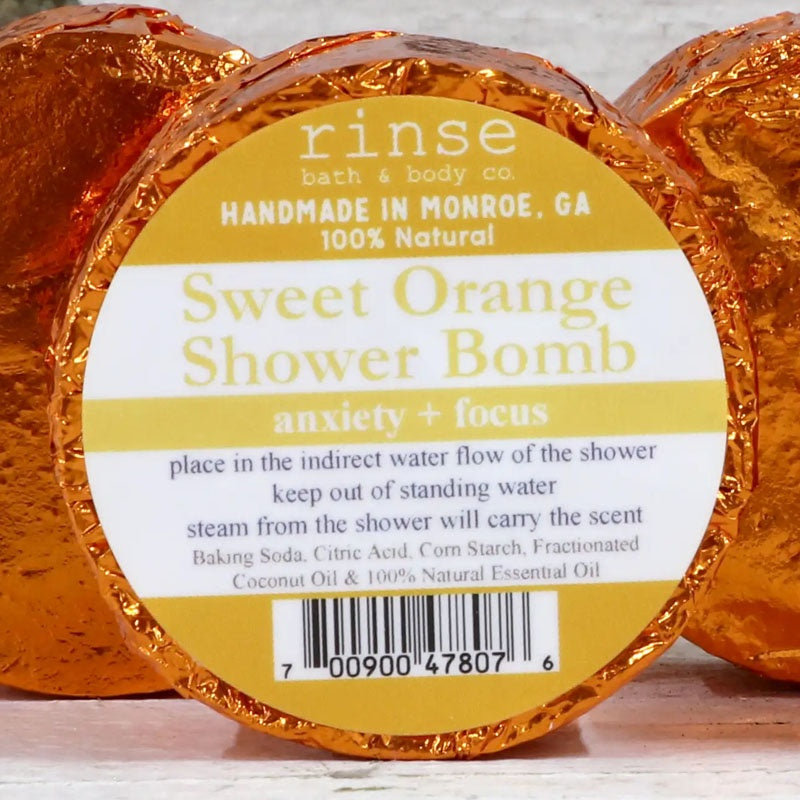 Sweet Orange Shower Bomb disk in orange foil wrapper