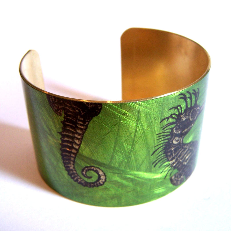 Metallic green brass cuff with seahorse design