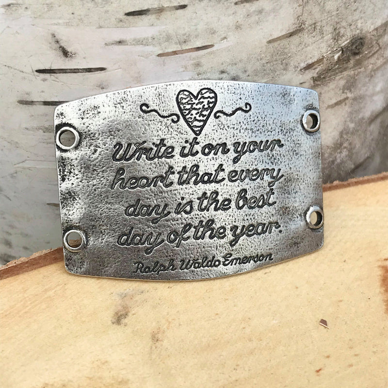 Antique silver colored Lenny & Eva bracelet sentiment that reads, "Write it on your heart that every day is the best day of the year." Quote by Ralph Waldo Emerson. Embellished with a heart design above the quote.