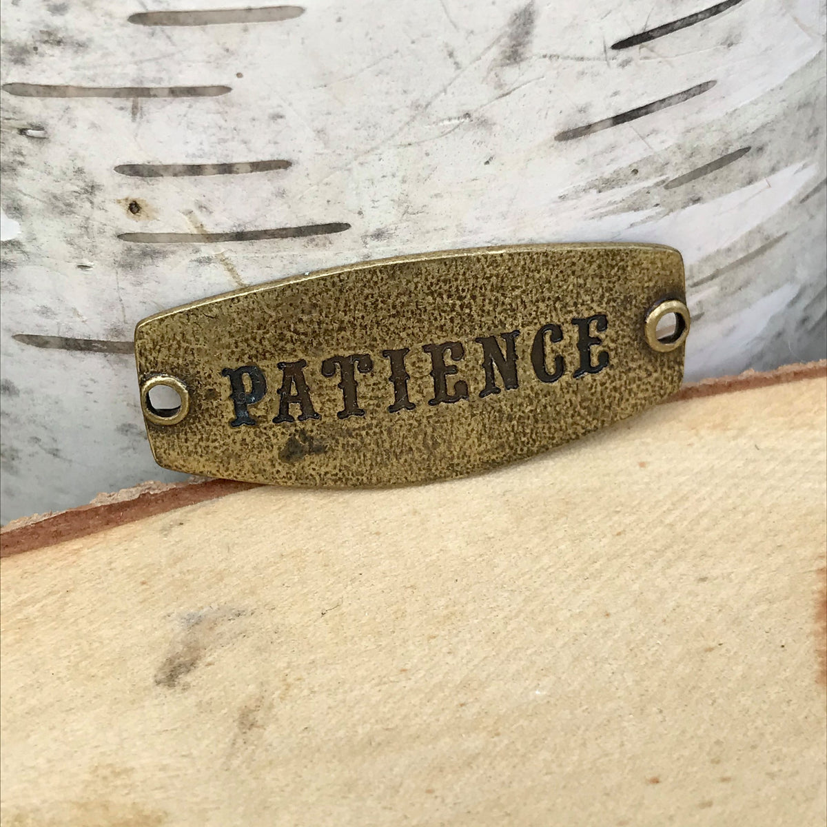 antique brass Lenny & Eva sentiment stamped with PATIENCE