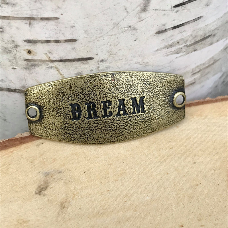 antique brass Lenny & Eva sentiment stamped with DREAM