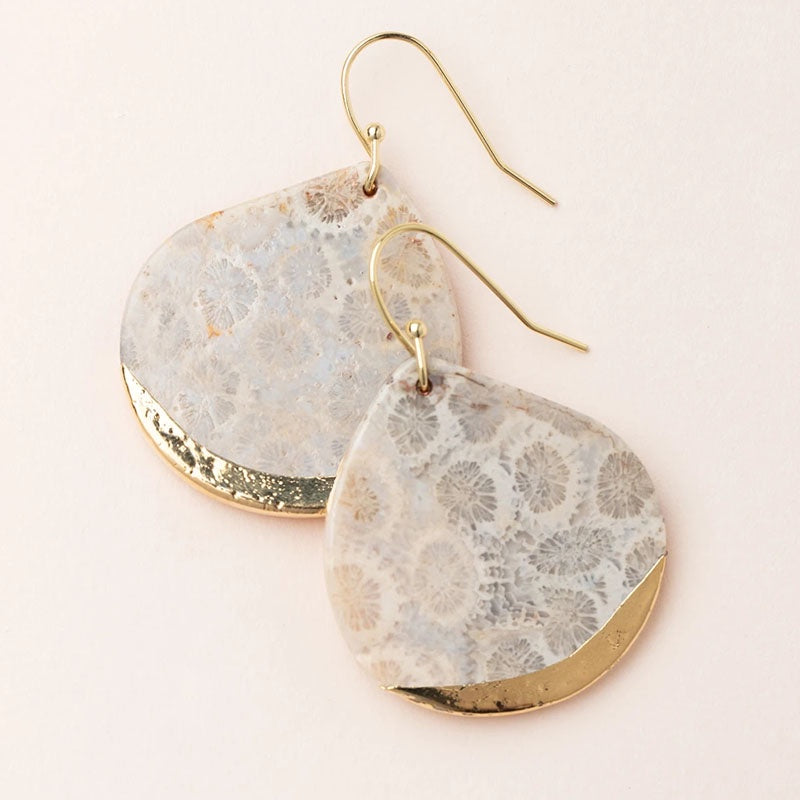 Ivory toned coral fossil stone earrings with gold wires and a gold dipped edge