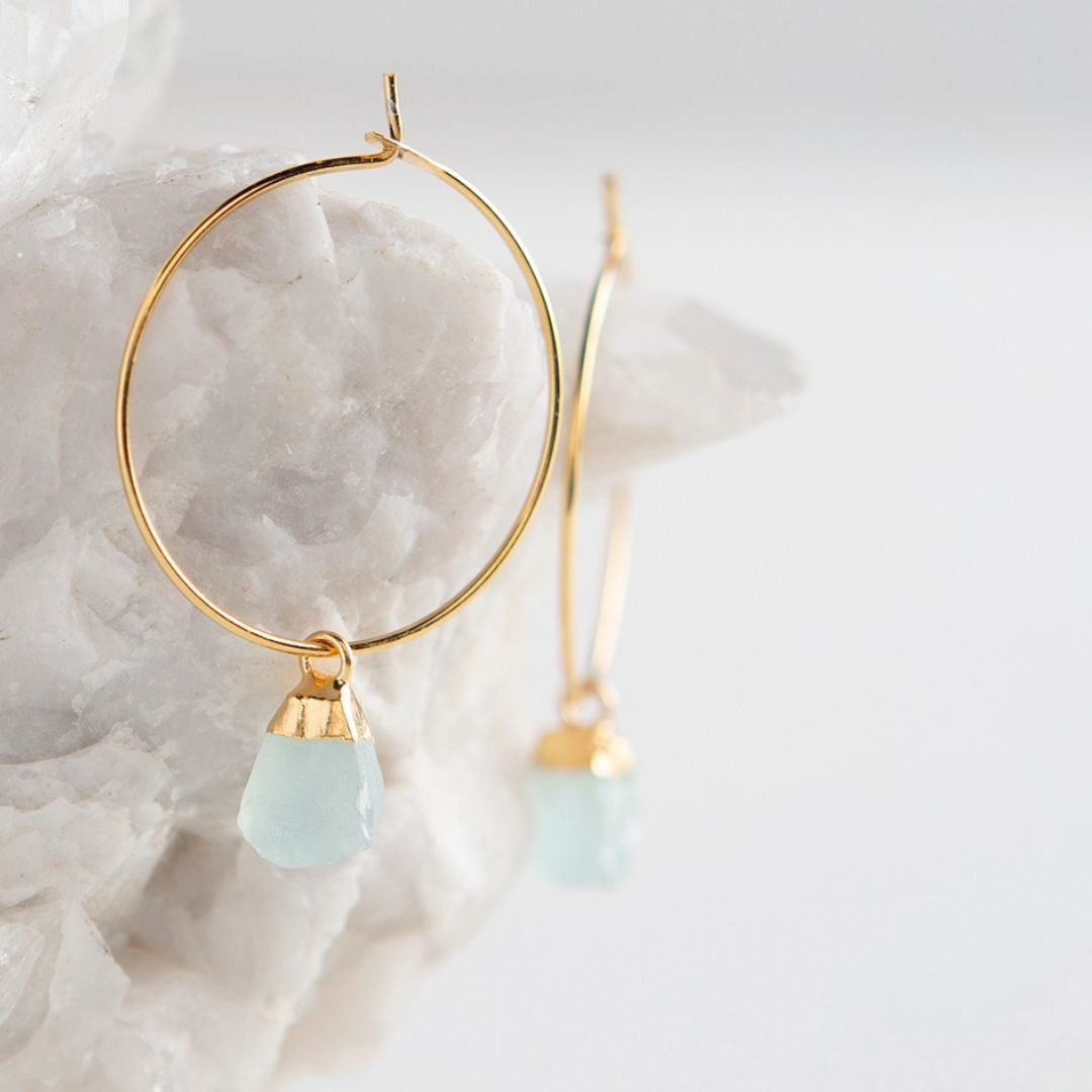 Small gold hoop earrings with light green amazonite nuggets
