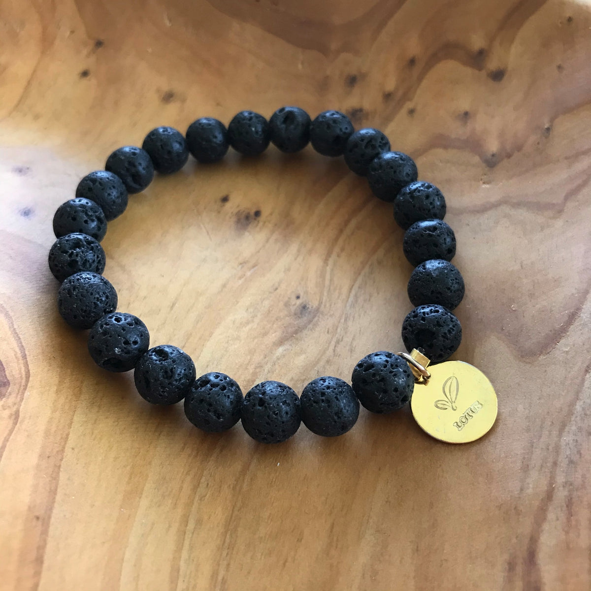 Black Lava Rock Essential Oil Aromatherapy Bracelet with Gold Charm by Lotus Jewelry Studio