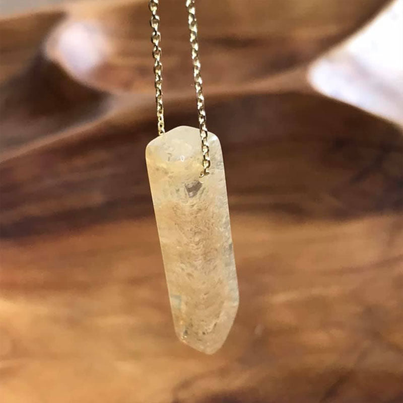 This clear and gold flecked citrine stone pendant inspires motivation, creativity, and concentration to bring you good fortune.