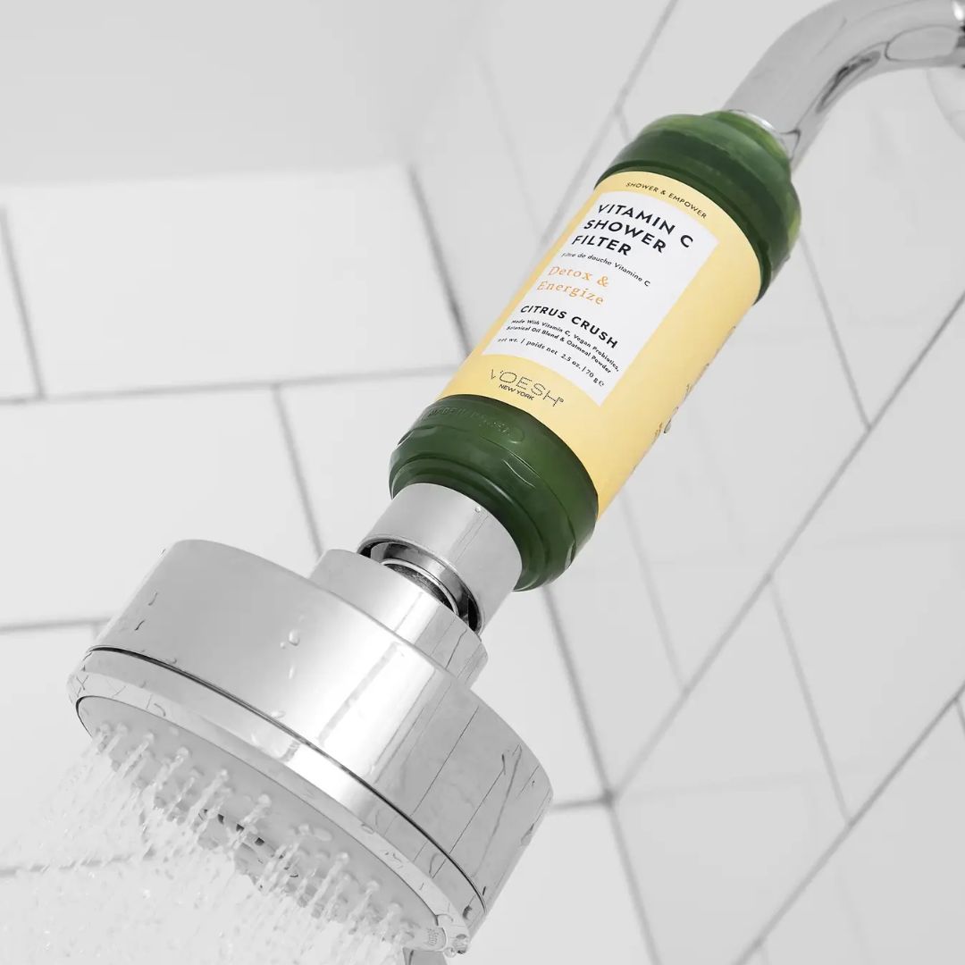 Vitamin C shower filter attached to shower head