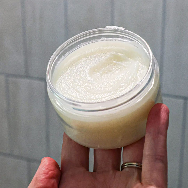 Open jar of Conditioning Balm. A creamy consistency.