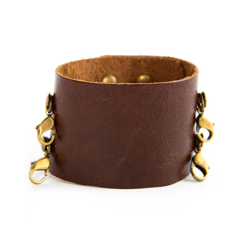 Dark chestnut wide leather cuff with brass clasps from Lenny & Eva jewelry