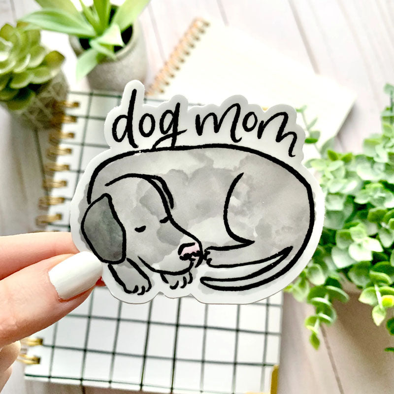 Sticker of a grey dog curled up with "dog mom" written above him