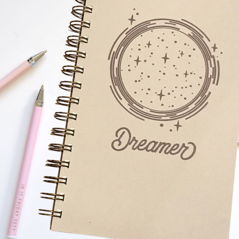 Brown journal with "Dreamer" on cover