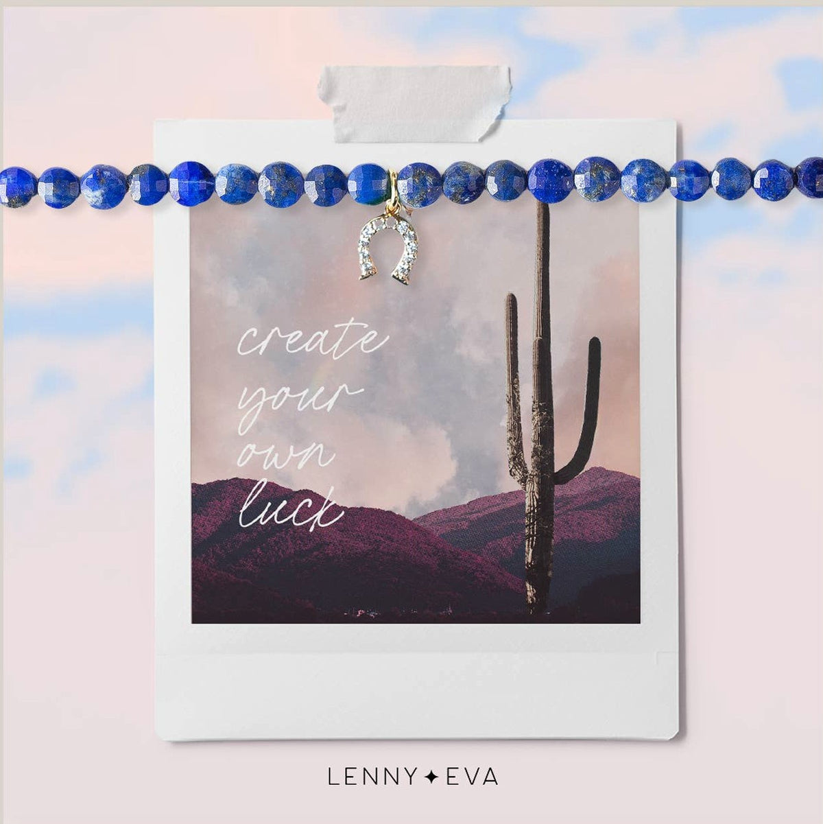Blue lapis lazuli beaded bracelet with a tiny cubic zirconia horseshoe charm. Packaged on a card with a desert background and the text "create your own luck"