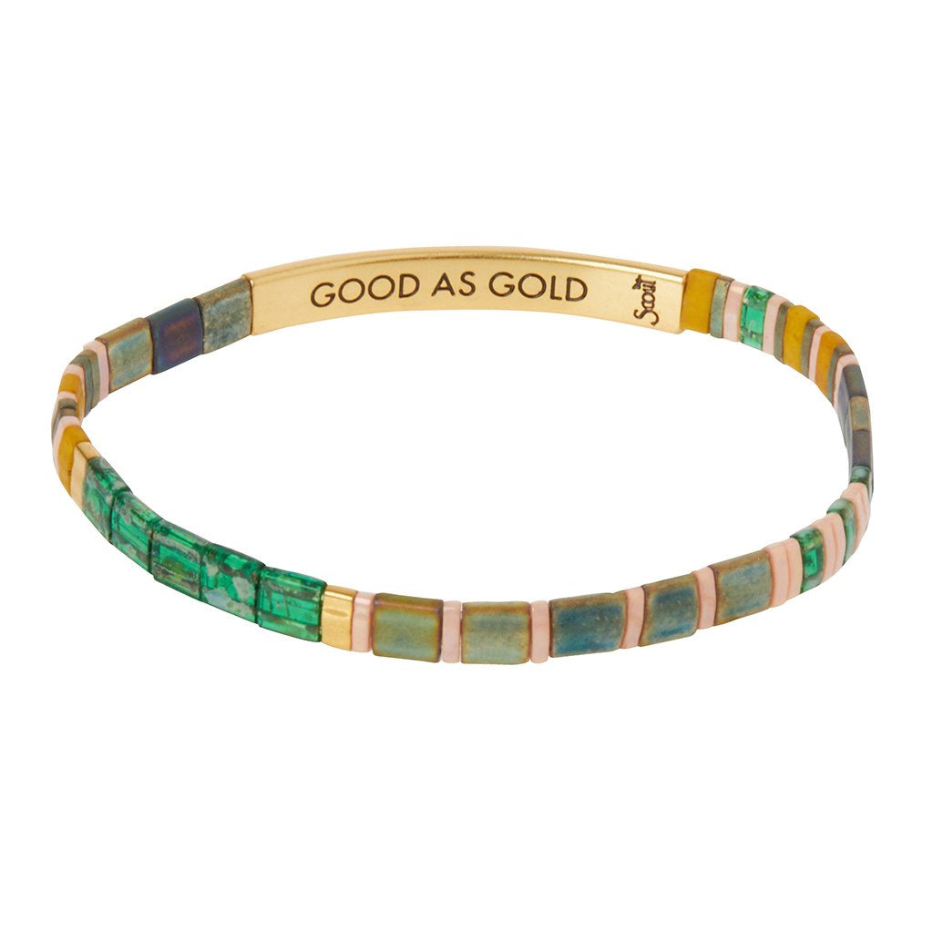 Bracelet in shades of green, iridescent blue, mustard, and pink beads with a gold band that says "GOOD AS GOLD"