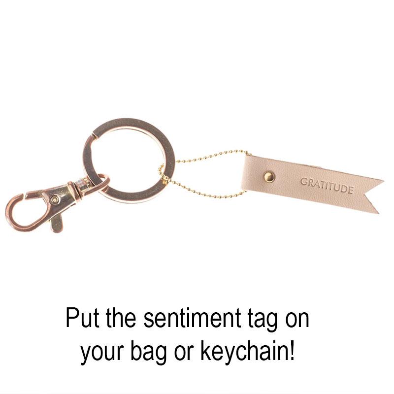 Leather sentiment tag attached to keychain