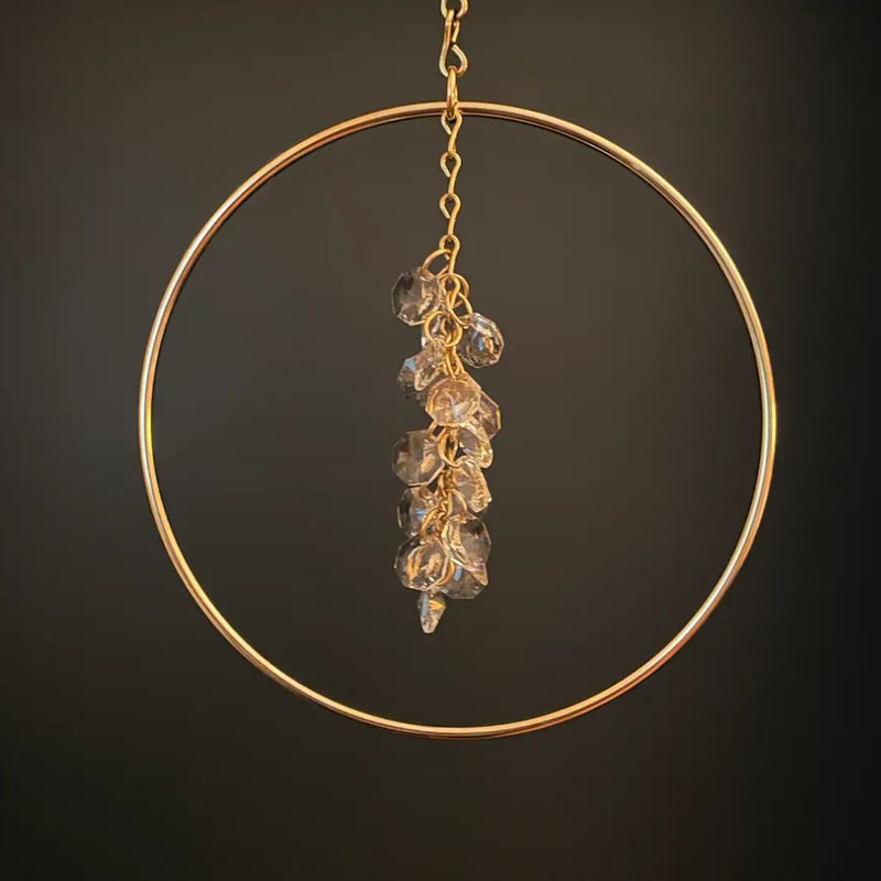 Brass circle sun catcher with a cluster of crystals