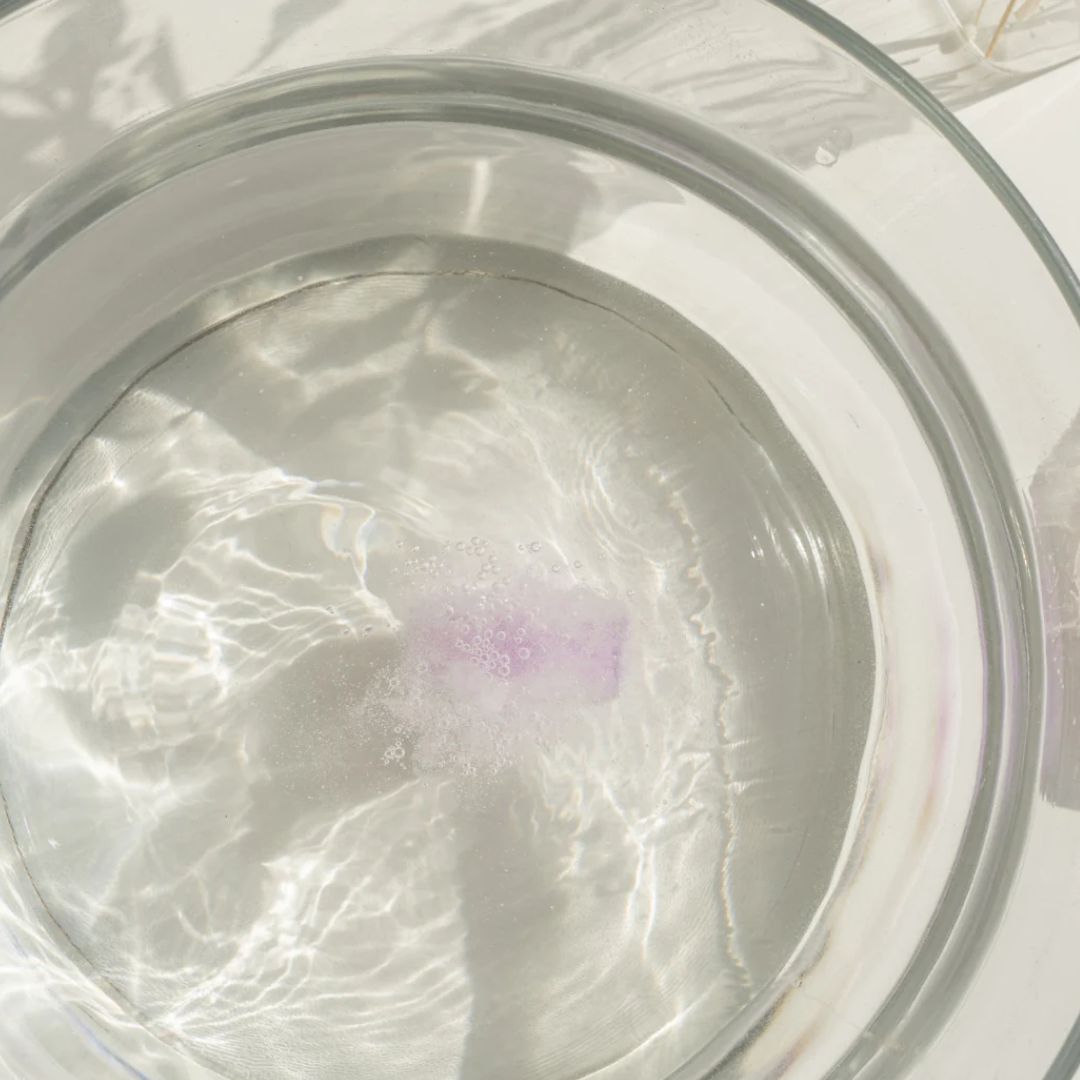 Lavender bath fizzy dissolving in water