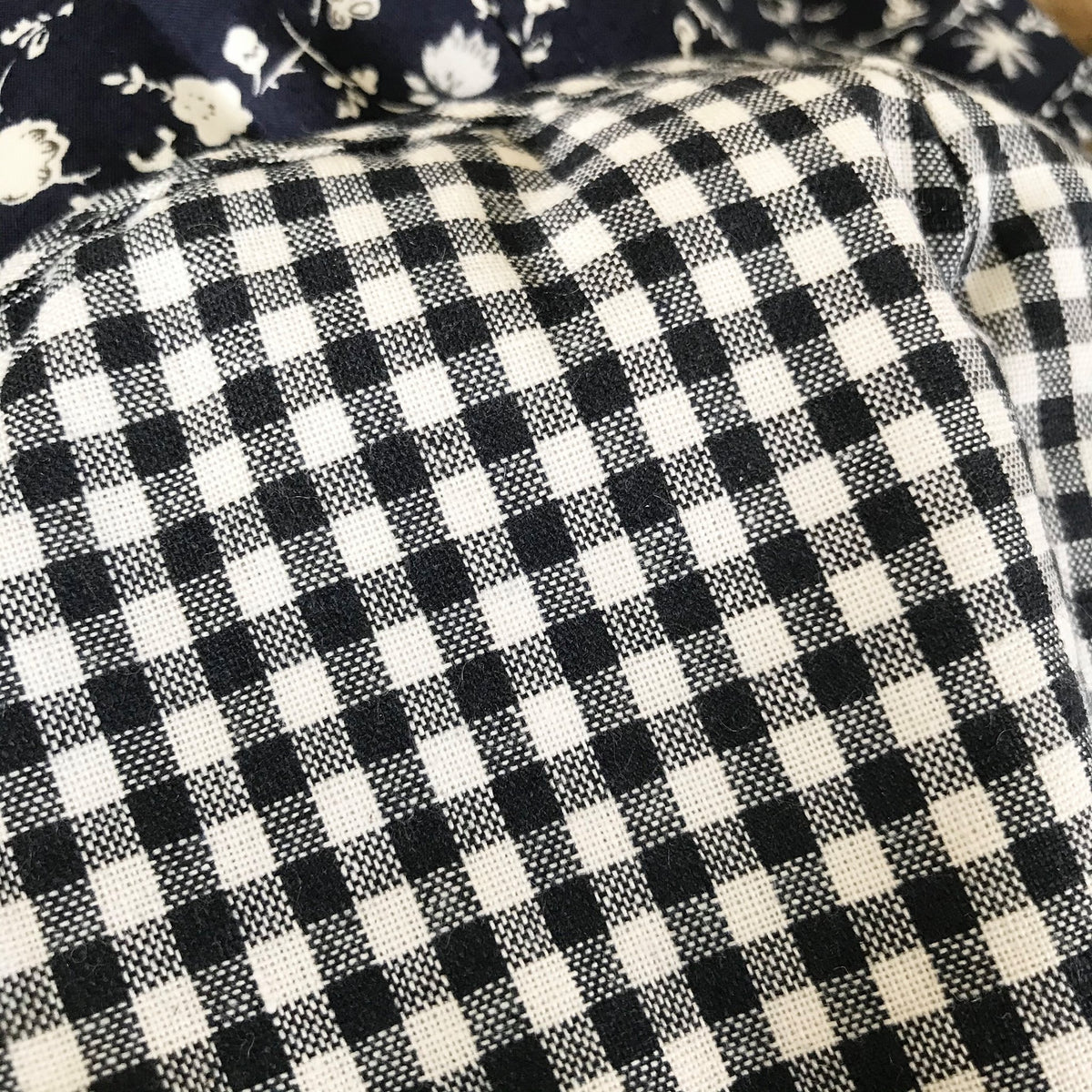 A close up view of the dark navy blue and white checked pattern that's great for women or men!