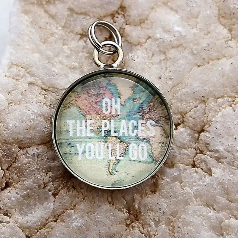 Circle pendant with a map background and text that reads "Oh the places you'll go"