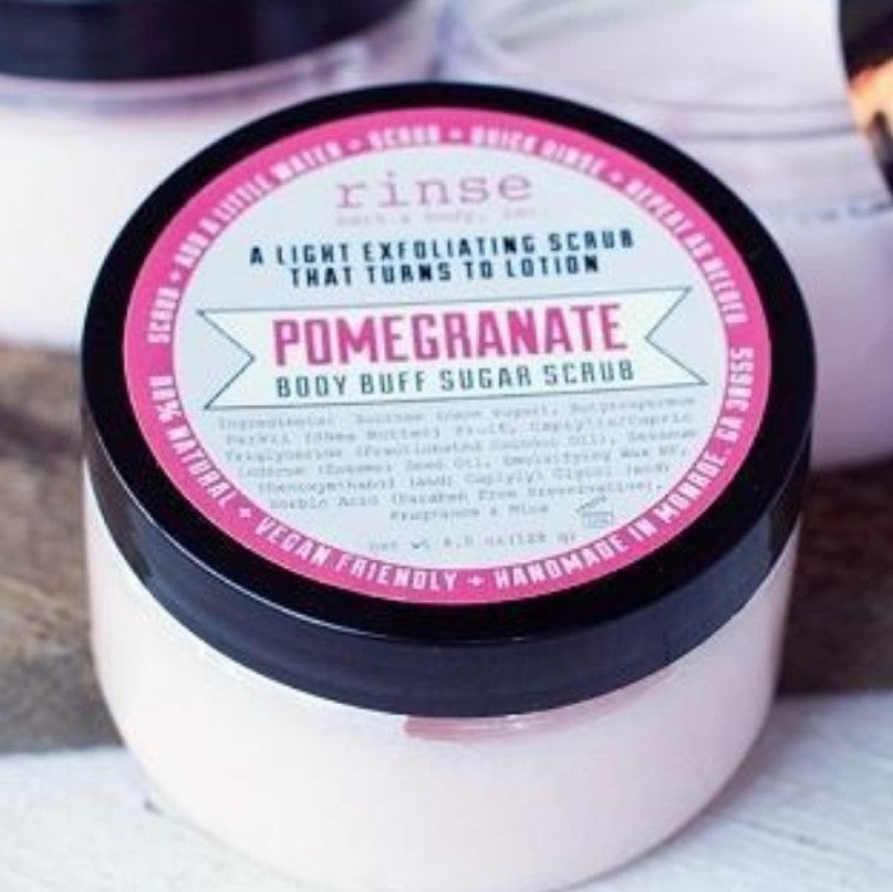 Jar of Pomegranate body scrub. Scrub is pink and jar has a pink label.
