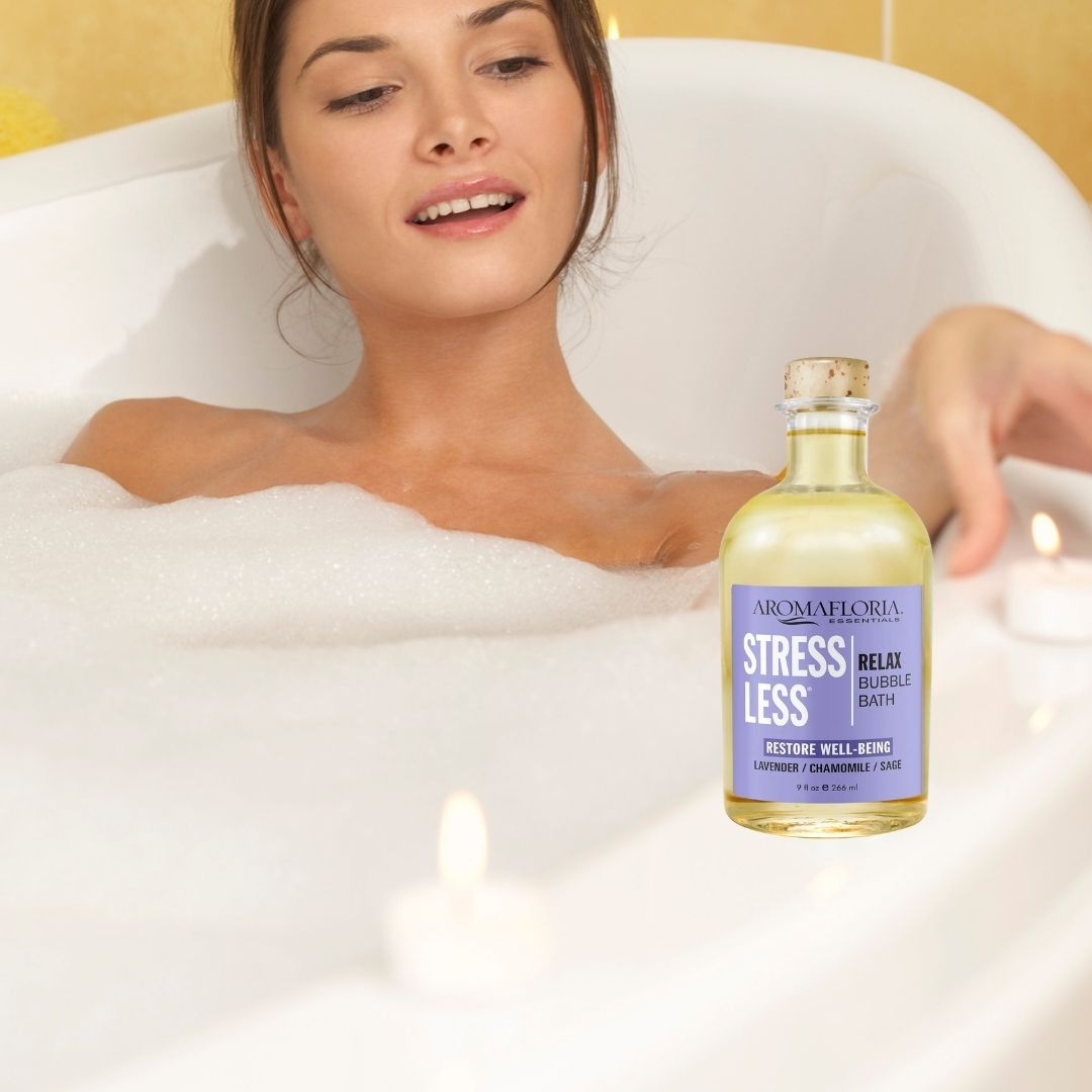 Bottle of Stress Less bubble bath sitting next to woman in bathtub