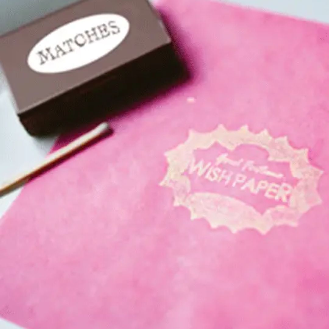 Pink wish paper with a package of matches