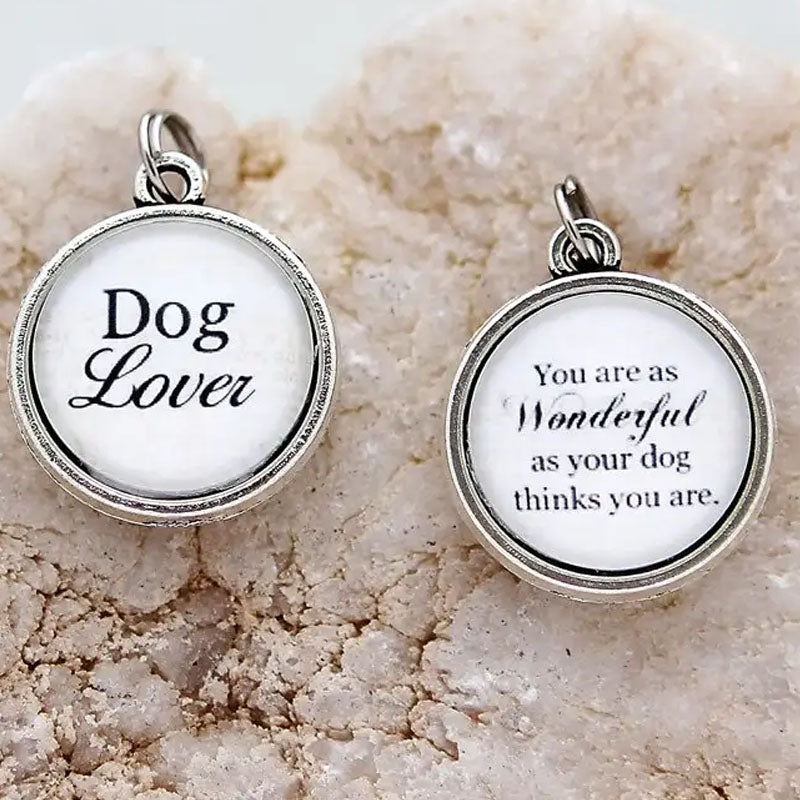 Reversible necklace pendant says "Dog Lover" on one side and on the reverse says "You are as wonderful as your dog thinks you are."