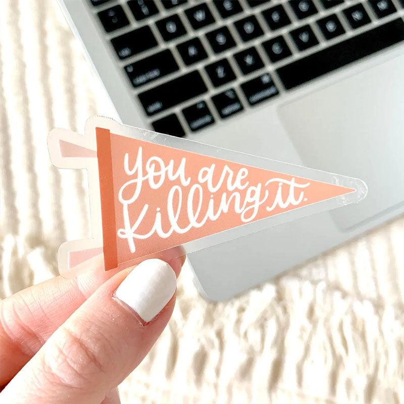 Peach colored pendant sticker that says "you are killing it"