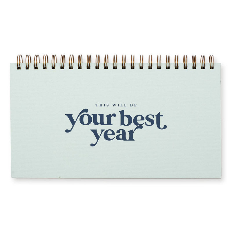 Light blue spiral bound checklist planner with "This will be your best year" in dark blue on the cover