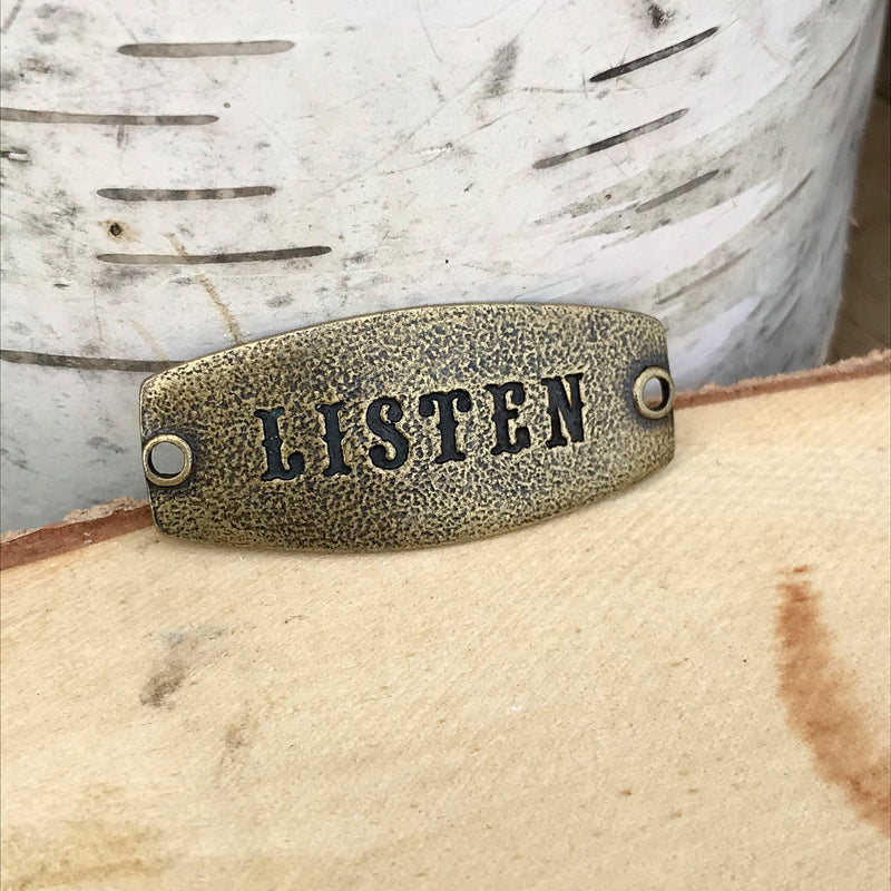 antique brass Lenny & Eva sentiment stamped with LISTEN