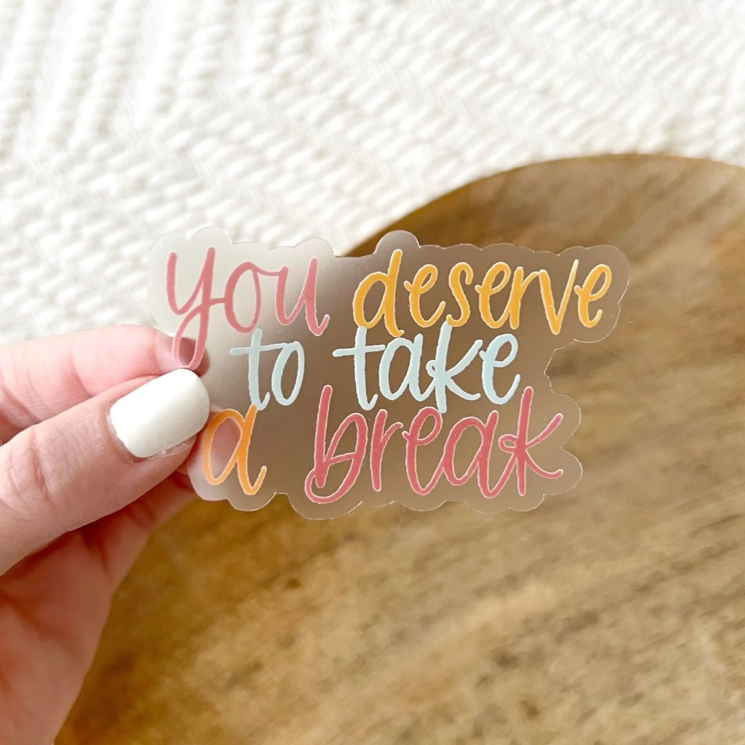 "you deserve to take a break" clear sticker with pastel writing by Elyse Breanne Designs